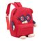 La fille badine le sac à dos rouge d'enfant de sacs d'école approprié à la vie scolaire quotidienne